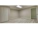 This room features a closet, light gray walls, wood-look floors, and an entrance to another room at 80 Surrey Chase Drive, Social Circle, GA 30025