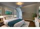 This furnished bedroom features stylish décor, rug, and wall art at 80 Surrey Chase Drive, Social Circle, GA 30025