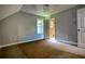 This is an empty bedroom showing the walls, carpet, window, and door to the bathroom at 80 Surrey Chase Drive, Social Circle, GA 30025