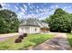 The exterior of a well-maintained home with an attached garage and lush green lawn at 80 Surrey Chase Drive, Social Circle, GA 30025