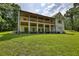 View of the deck and light siding from the backyard at 80 Surrey Chase Drive, Social Circle, GA 30025