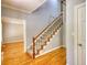 Foyer with hardwood floors and staircase with white railing at 80 Surrey Chase Drive, Social Circle, GA 30025
