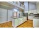 Bright kitchen with an island, granite countertops, and stainless steel appliances at 80 Surrey Chase Drive, Social Circle, GA 30025