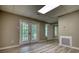 This bright, open living room features access to the exterior of the house at 80 Surrey Chase Drive, Social Circle, GA 30025