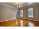 Sunlit living room featuring hardwood floors and neutral wall colors at 80 Surrey Chase Drive, Social Circle, GA 30025