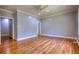 Bright and airy main bedroom with gray walls and hardwood floors at 80 Surrey Chase Drive, Social Circle, GA 30025