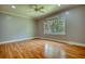 Large main bedroom features wood floors and a large picture window at 80 Surrey Chase Drive, Social Circle, GA 30025