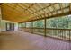 Expansive wooden porch perfect for entertaining with views of a lush, green backyard and forest at 80 Surrey Chase Drive, Social Circle, GA 30025