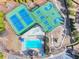 Aerial view showcasing tennis courts, basketball court, playground, and a sparkling pool at 1099 Sandy Bank Ct, Auburn, GA 30011