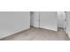 Neutral bedroom showcasing carpet flooring, white walls, and easy access to closets at 1099 Sandy Bank Ct, Auburn, GA 30011
