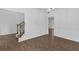Open dining area with chandelier, hardwood floors, chair rail, and staircase nearby at 1099 Sandy Bank Ct, Auburn, GA 30011