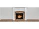 Elegant fireplace with marble surround and white mantel, perfect for cozy evenings at 1099 Sandy Bank Ct, Auburn, GA 30011