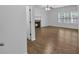 Bright, open living room featuring a fireplace and wood-look flooring at 1099 Sandy Bank Ct, Auburn, GA 30011