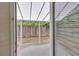 Covered back patio with a view of the fenced-in backyard at 1099 Sandy Bank Ct, Auburn, GA 30011