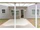 Covered back patio with a concrete base and view of the rear of the property at 1099 Sandy Bank Ct, Auburn, GA 30011