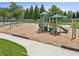 Community playground with slides, swings, and play structures on a wood chip safety surface at 1099 Sandy Bank Ct, Auburn, GA 30011