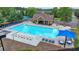 Beautiful community pool surrounded by seating and a covered area perfect for relaxing at 1099 Sandy Bank Ct, Auburn, GA 30011