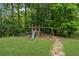The backyard features a playset that offers lots of fun and space for outdoor adventures at 1784 Brookstone Nw Ct, Acworth, GA 30101