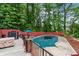 Backyard area features a pool with a cover and lounge area perfect for entertaining at 1784 Brookstone Nw Ct, Acworth, GA 30101