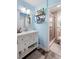 This bathroom features a modern vanity, a shower, and natural lighting at 1784 Brookstone Nw Ct, Acworth, GA 30101