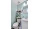 This bathroom boasts convenient storage and a classic toilet for everyday functionality at 1784 Brookstone Nw Ct, Acworth, GA 30101