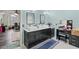Bathroom with double sinks, vanity area, and a window at 1784 Brookstone Nw Ct, Acworth, GA 30101