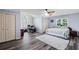 Spacious bedroom features a ceiling fan, multiple closets, and natural light at 1784 Brookstone Nw Ct, Acworth, GA 30101