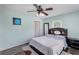 Spacious bedroom featuring a ceiling fan, natural light, and ample space at 1784 Brookstone Nw Ct, Acworth, GA 30101