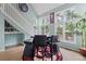 Dining area features large windows, hardwood floors, and unique decor at 1784 Brookstone Nw Ct, Acworth, GA 30101