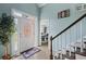 Welcoming foyer with a decorative front door, hardwood floors, and a staircase at 1784 Brookstone Nw Ct, Acworth, GA 30101
