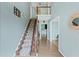 Bright foyer with hardwood floors, staircase, and views of the upper level at 1784 Brookstone Nw Ct, Acworth, GA 30101