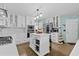 Clean kitchen with white cabinetry, island, and stainless steel appliances at 1784 Brookstone Nw Ct, Acworth, GA 30101