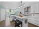 Bright kitchen with granite countertops, stainless appliances, and center island with stools at 1784 Brookstone Nw Ct, Acworth, GA 30101