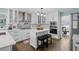 Modern kitchen with white cabinets, stainless steel appliances, and center island at 1784 Brookstone Nw Ct, Acworth, GA 30101