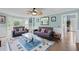 Spacious living room with hardwood floors, comfortable seating, and natural light at 1784 Brookstone Nw Ct, Acworth, GA 30101