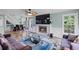Bright living room with fireplace, hardwood floors, and staircase access at 1784 Brookstone Nw Ct, Acworth, GA 30101