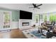 Cozy living room with a marble fireplace, plush seating, and backyard views at 1784 Brookstone Nw Ct, Acworth, GA 30101
