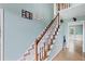 View of the staircase with hardwood floors and railing at 1784 Brookstone Nw Ct, Acworth, GA 30101