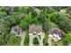Aerial shot of a charming home nestled among mature trees in a serene residential area at 2503 Regency Lake Dr, Marietta, GA 30062