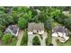 Expansive aerial view of a home surrounded by lush greenery in a quiet neighborhood at 2503 Regency Lake Dr, Marietta, GA 30062