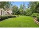 Manicured lawn and landscaping in backyard of estate home at 2503 Regency Lake Dr, Marietta, GA 30062