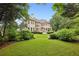 Estate home backyard with manicured lawn and landscaping at 2503 Regency Lake Dr, Marietta, GA 30062
