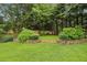 Well manicured backyard with mature trees and level ground at 2503 Regency Lake Dr, Marietta, GA 30062