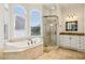 Beautiful bathroom featuring a soaking tub, walk-in shower, and large window at 2503 Regency Lake Dr, Marietta, GA 30062