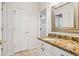 Bathroom with granite countertop, white cabinets, brushed nickel fixtures, and walk-in shower at 2503 Regency Lake Dr, Marietta, GA 30062