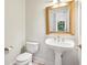 Charming powder room with a classic pedestal sink and decorative gold-framed mirror at 2503 Regency Lake Dr, Marietta, GA 30062
