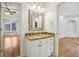 Well-lit bathroom featuring a granite countertop, white cabinets, brushed nickel fixtures, and tile flooring at 2503 Regency Lake Dr, Marietta, GA 30062