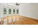 Expansive bedroom featuring hardwood floors, recessed lighting, a ceiling fan, and multiple windows at 2503 Regency Lake Dr, Marietta, GA 30062