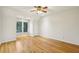 Bedroom featuring hardwood floors, a ceiling fan, a window, and closet at 2503 Regency Lake Dr, Marietta, GA 30062