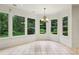 Breakfast nook with chandelier features floor-to-ceiling windows and backyard views at 2503 Regency Lake Dr, Marietta, GA 30062